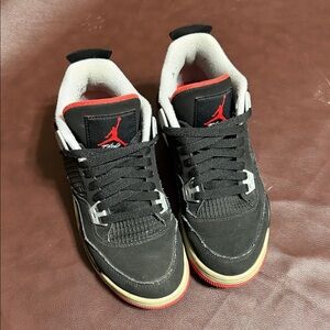 Nike Air Jordan 4 Black with Red and Cream Accents